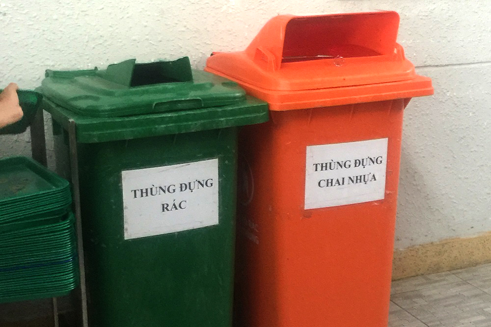 Recyclable and non-recyclable trash containers are located throughout TDTU